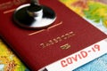 COVID 19 traveling document on world map background