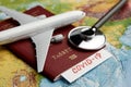 COVID 19 traveling document on world map background