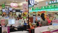 Shenzhen, China: shoppers check out at the cash desk of aeon supermarket