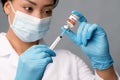 Covid-19 Vaccination. African American Female Doctor Ffilling Syringe With Medication For Injection Royalty Free Stock Photo