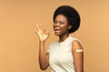Covid-19 vaccination: happy black woman with bandage after coronavirus vaccine showing okay gesture Royalty Free Stock Photo