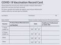 Covid 19 vaccination record card in both English and Spanish languages. Individual record for use during the covid 19 coronavirus Royalty Free Stock Photo