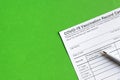 COVID-19 Vaccination Record Card on green background Royalty Free Stock Photo