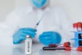 COVID vaccine. Competent medical worker spending his work time in the laboratory while researching coronavirus disease