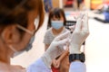 Doctor vaccinating students in school