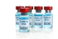 Covid 19 vaccine. Medical ampoules and syringe