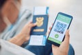 Covid vaccine passport on a phone for travel, safety or security in global pandemic. Airport, smartphone app with