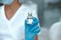 COVID-19 vaccine in researcher hands, female doctor holds syringe and bottle with vaccine for coronavirus cure Royalty Free Stock Photo