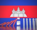 COVID-19 vaccine vial prevents falling of people figures at the flag of Cambodia. Medical conceptual 3D rendering Royalty Free Stock Photo