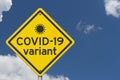 COVID-19 variant warning on a on yellow highway caution road sign