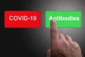 COVID-19 Virus Vaccine discovery or antibodies research success concept, Red and green buttons with Covid-19 and antibodies text