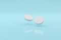 Covid - 19 White round pills on soft blue background
