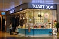 Covid-19. Wide angle of Toast Box restaurant at Changi Airport Jewel food court. Minimal business operations; customer ordering