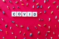 COVID word on red background