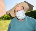 Elderly man wearing face mask as Coronavirus protection,Hampshire,United Kingdom Royalty Free Stock Photo