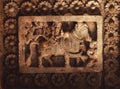 Cow and ancient villagers on ceiling of 12th century historical stone Hindu temple, Halebidu, India.