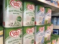 Cow & Gate infant milk on shelves of a supermarket