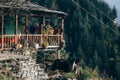 Cow grazing by a house in the mountains in Himachal Pradesh, India Royalty Free Stock Photo