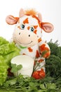 Cow with milk and greenery. Royalty Free Stock Photo