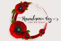 Remembrance day lest we forget. realistic red poppy flower international symbol of peace with paper cut art and craft style on col Royalty Free Stock Photo