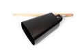 Cowbell percussion musical instrument, black metal with a wooden stick Royalty Free Stock Photo