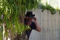 Cowboy in bandana looking through binoculars