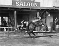 Cowboy being thrown off his horse