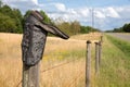 Cowboy Boot on Fence Post Royalty Free Stock Photo