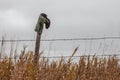 Cowboy boot hanging on a fence post Royalty Free Stock Photo