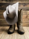 Cowboy boot and western hat on wooden Royalty Free Stock Photo