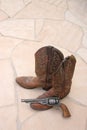 Cowboy Boots & Gun On Flagstone