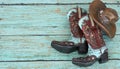 Cowboy boots and hat on a teal background Royalty Free Stock Photo