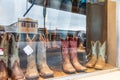 Cowboy boots in a storefront window in the Texas hill country