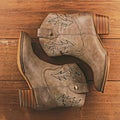 Cowboy boots on wooden background