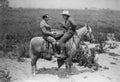 Cowboy and businessman playing checkers on horseback Royalty Free Stock Photo