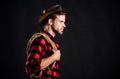 Cowboy can carry tune. Vintage style man. Wild West retro cowboy. man checkered shirt on ranch. western cowboy portrait Royalty Free Stock Photo