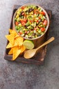Cowboy caviar or texas caviar salad dip with black bean, tomatoes, avocado, red and green bell pepper, corn, coriander closeup in Royalty Free Stock Photo