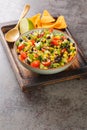 Cowboy caviar or texas caviar salad dip with black bean, tomatoes, avocado, red and green bell pepper, corn, coriander closeup in Royalty Free Stock Photo