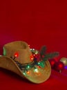 Cowboy Christmas.American West cowboy hat on christmas red background Royalty Free Stock Photo