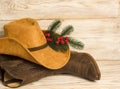 Cowboy Christmas.American West traditional boots and hat on wood Royalty Free Stock Photo