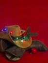 Cowboy Christmas.American West traditional boots on christmas re Royalty Free Stock Photo