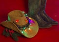 Cowboy Christmas.American West traditional boots on christmas re Royalty Free Stock Photo