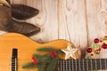 Cowboy christmas background with guitar and cowboy boots Royalty Free Stock Photo