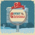 Cowboy christmas card with western hat and text on wood board Royalty Free Stock Photo