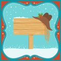 Cowboy Christmas card with western hat and wood board background Royalty Free Stock Photo