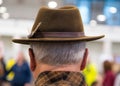 Cowboy couture. Portrait of older man wearing cowboy hat from behind