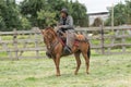 Cowboy in Ecuador riding a horse