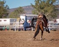 Cowboy Falling Off Bucking Horse