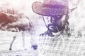 Cowboy Farmer wearing Straw Hat on Horse Ranch