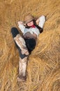 Cowboy girl lying in a field of grass Royalty Free Stock Photo